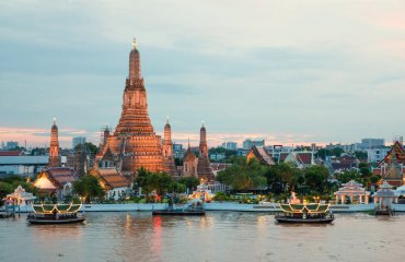 Wat Arun and cruise ship in night ,Bangkok city ,Thailand
